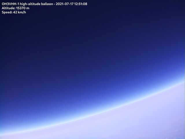 Some kind of foggy layer in the atmosphere above altitude of 10 km producing beautiful color gradients.